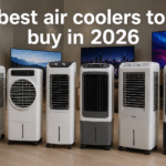 Ultra-realistic lineup of modern air coolers displayed in a premium showroom with large TVs in the background and the text "best air coolers to buy in 2026" prominently featured at the top.